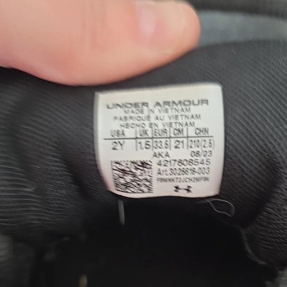 Under Armour Kids Black Sneakers with Gold Accents